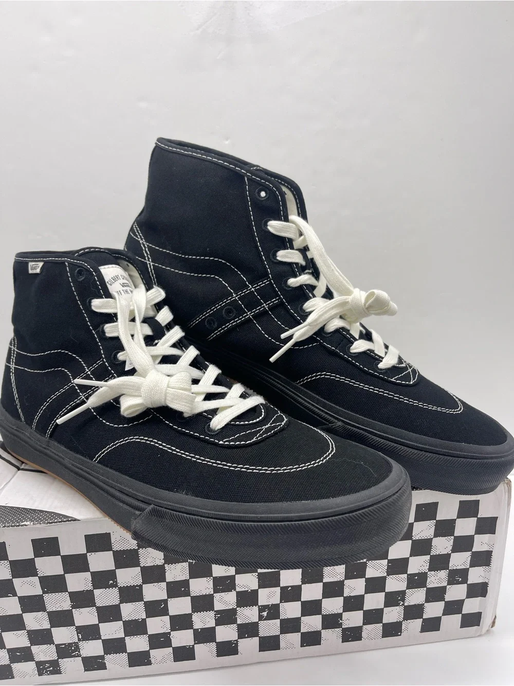 Vans Men’s High-Top Canvas Sneakers in Black and White
